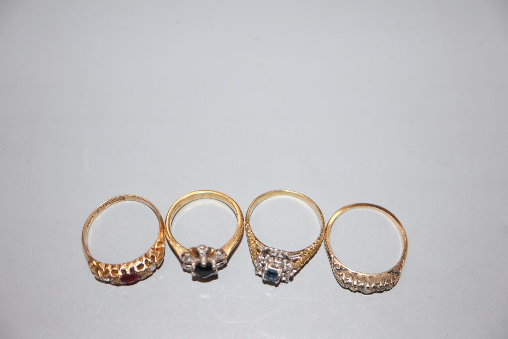 Four assorted 18ct gold and gem set dress rings